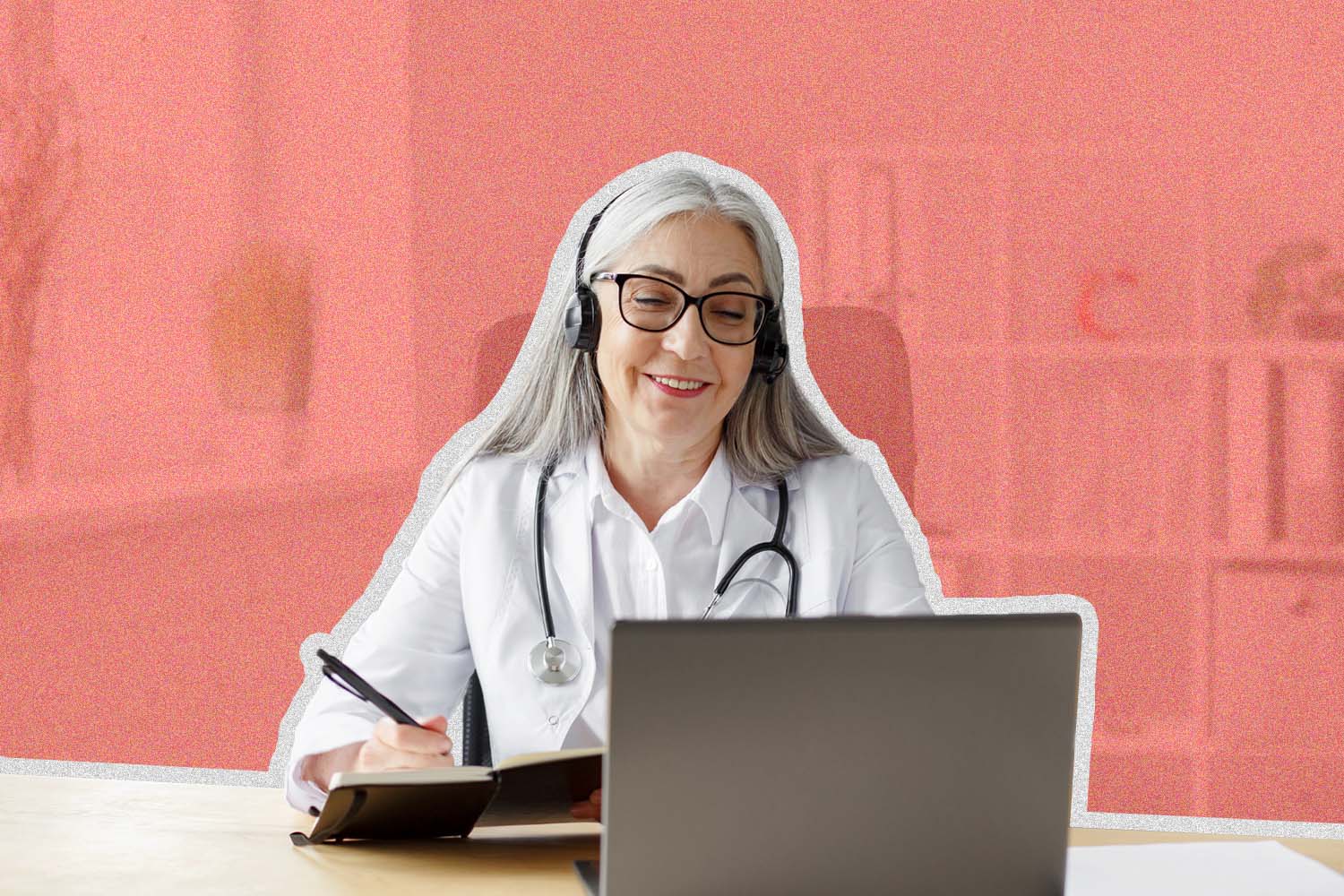 Woman doctor wearing a stethoscope and sitting at a computer