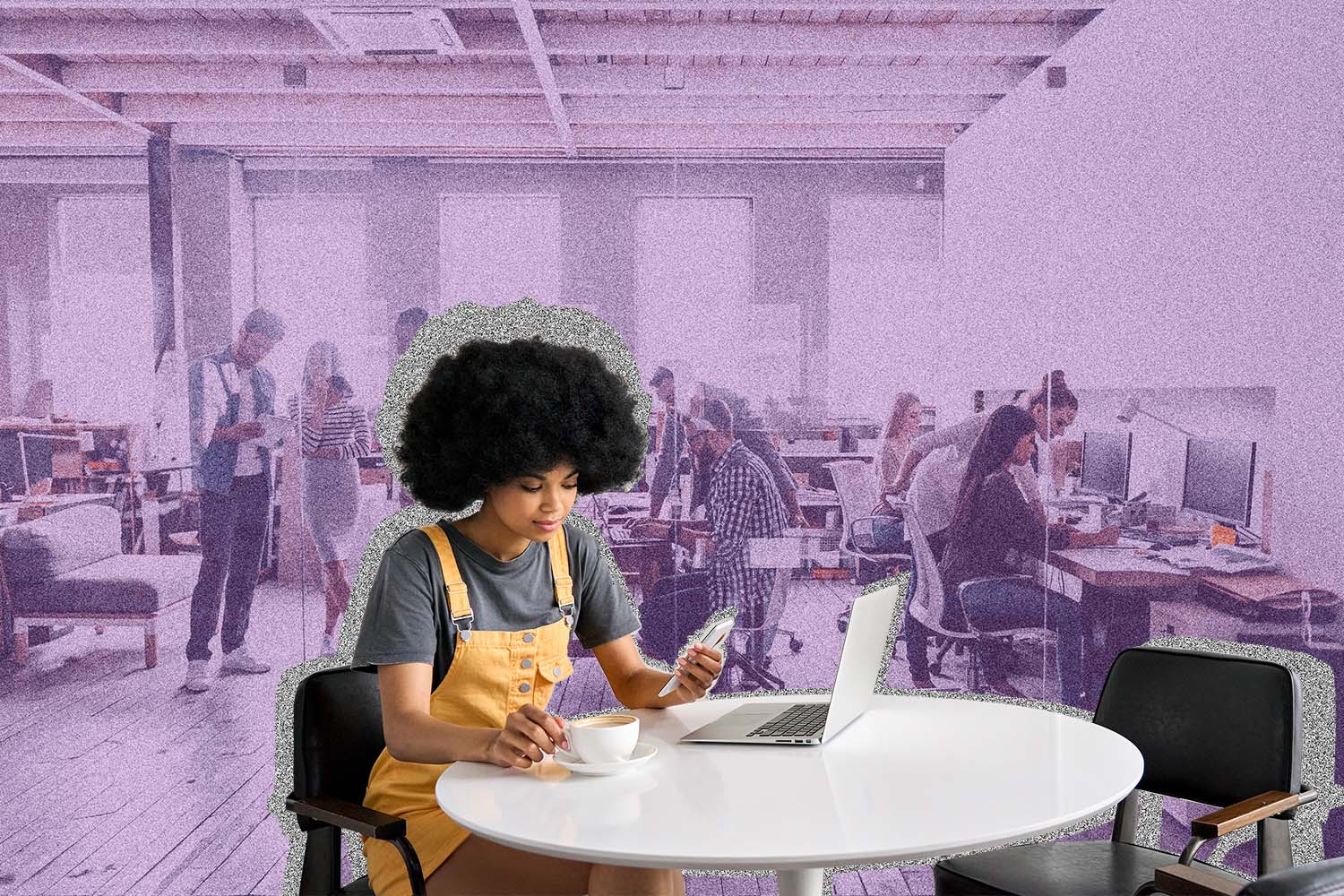 Young woman sits at table in office space.