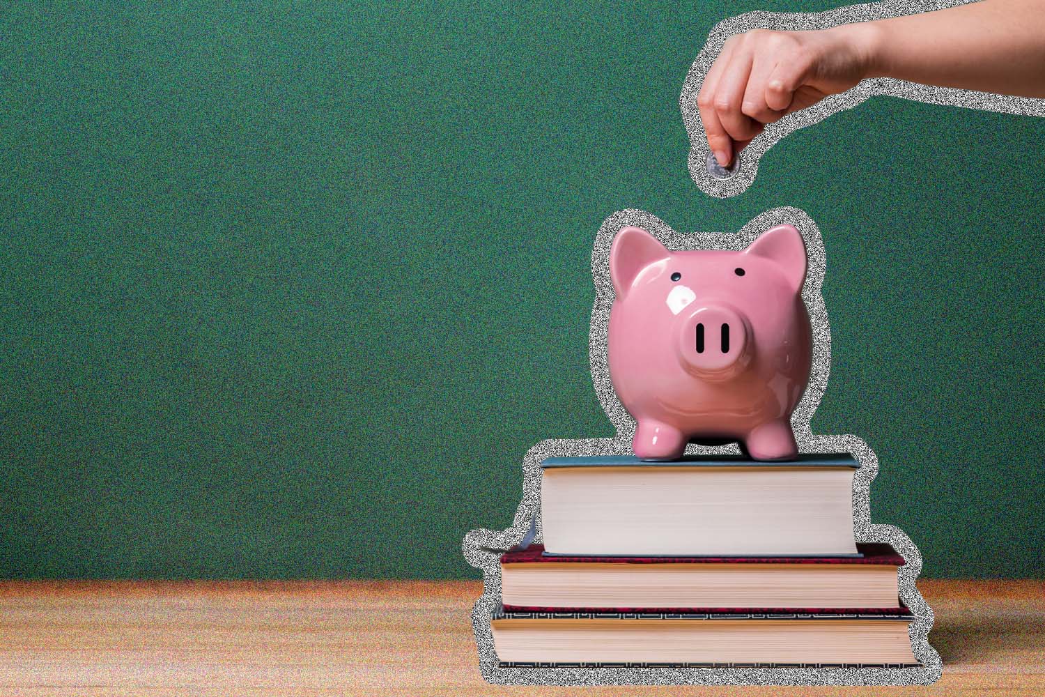 Person putting money into a piggy bank