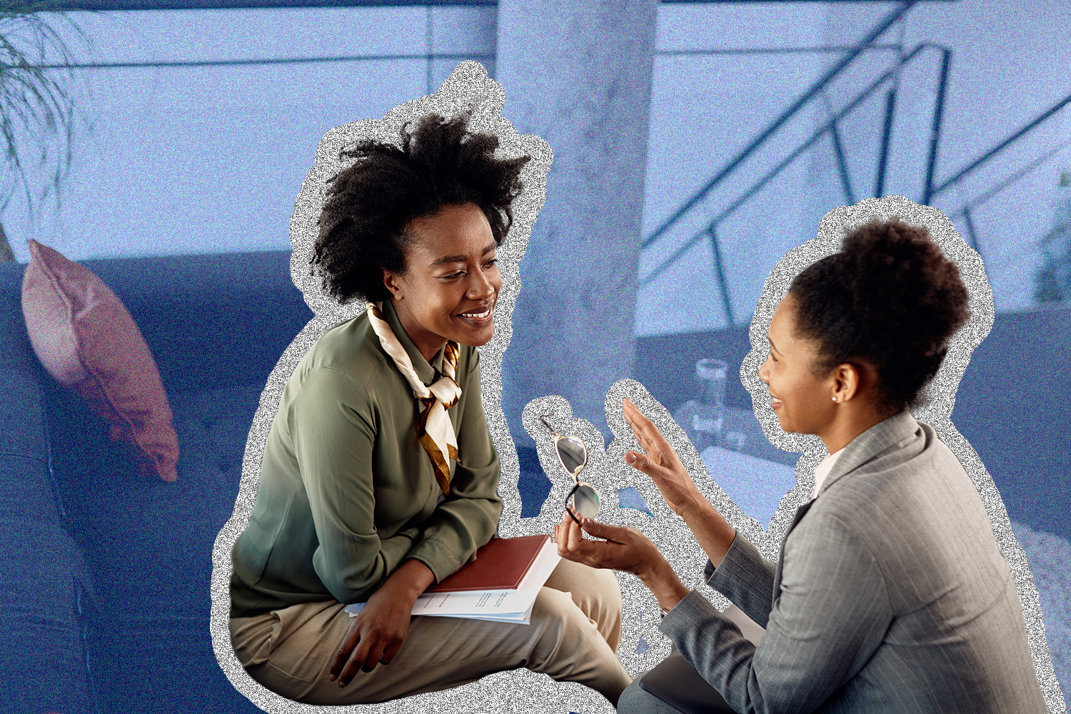 A Black female mentor speaking with her Black female mentee