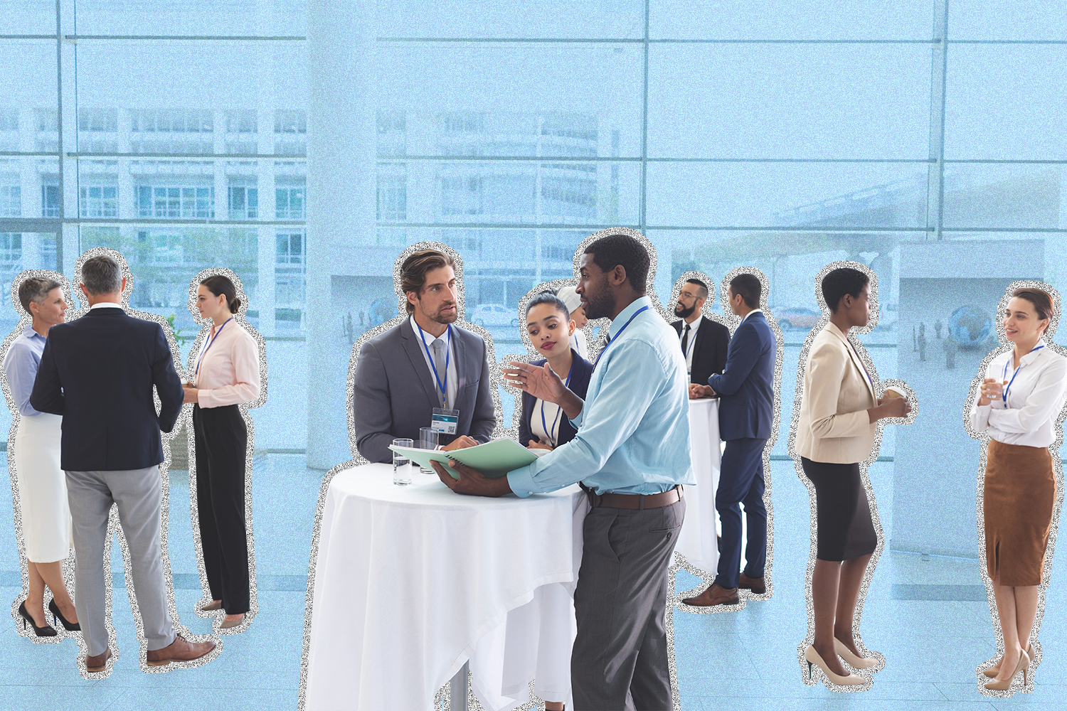 Business professionals standing around tables having conversations,