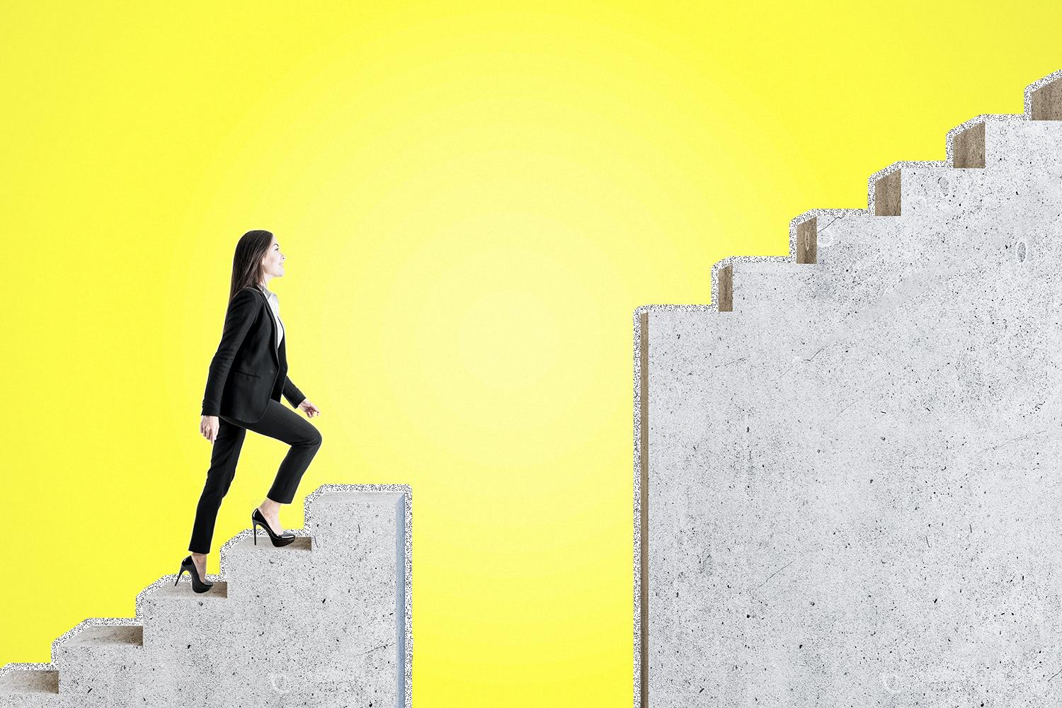 A woman climbing a staircase that has a gap in the stairs.