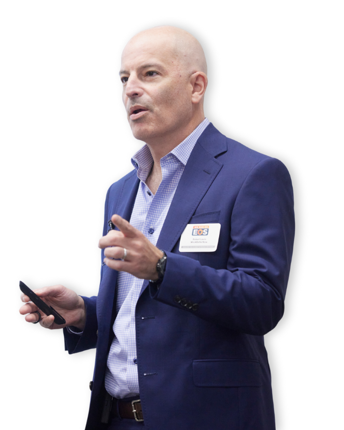 Rob Levin, founder of WorkBetterNow and author of The New Talent Playbook, speaking to a group of business leaders while gesturing during a presentation.