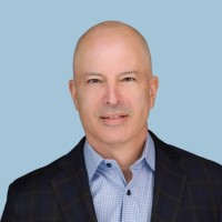 Headshot of Rob Levin, founder of WorkBetterNow and author of The New Talent Playbook, wearing a dark blazer and light blue shirt against a light blue background.
