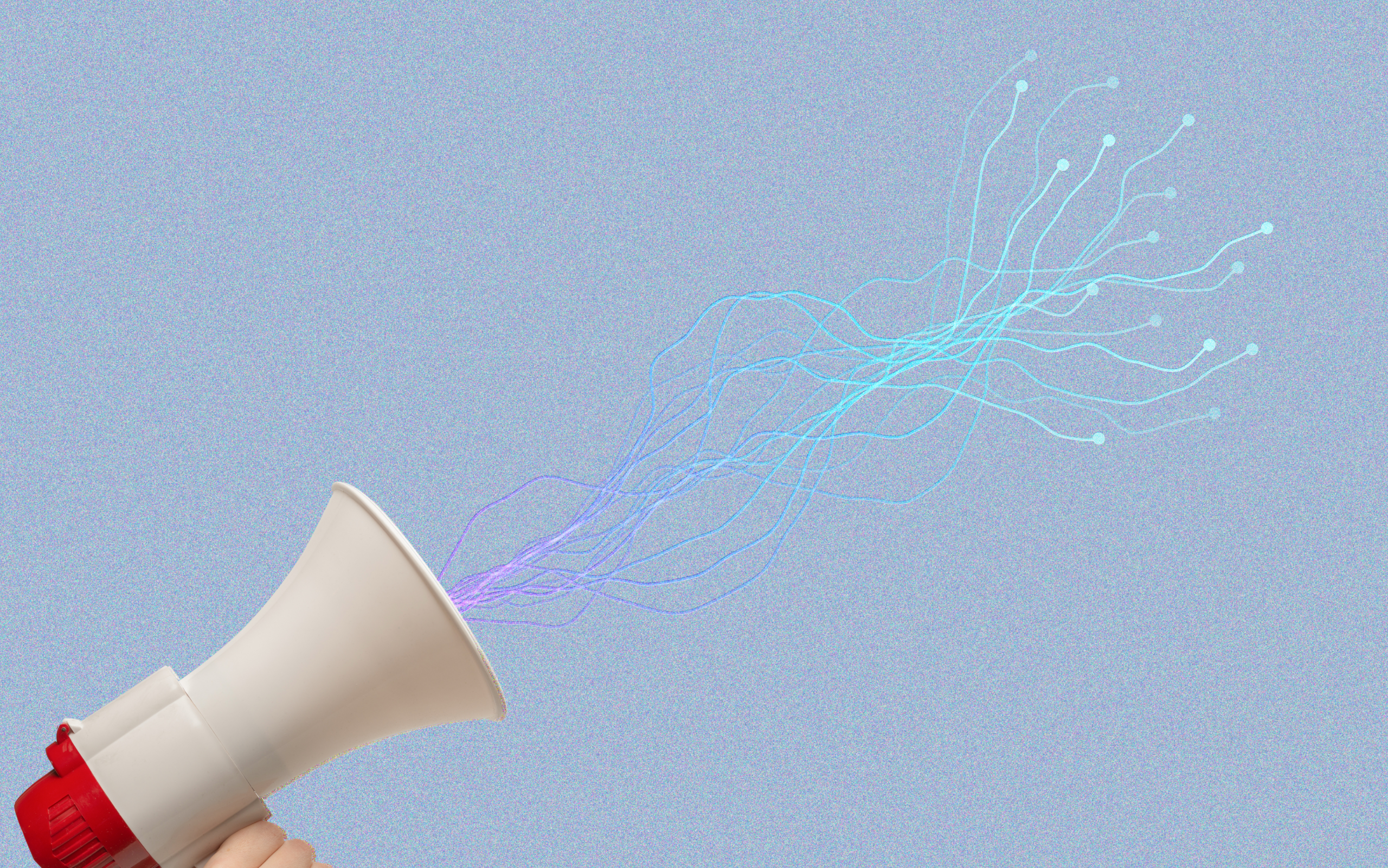 Hand holding a red-and-white megaphone against a soft blue background, with glowing branching lines flowing from the speaker like digital signals or data pathways, illustrating how brands can extend messaging across regions while navigating cultural nuance in global campaigns.